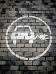 Road sign indicating that electric cars can be charged on Diagonal Avenue in the city of Barcelona in Catalonia and Spain Road sign indicating that electric cars can be charged on Diagonal Avenue in the city of Barcelona in Catalonia and Spain